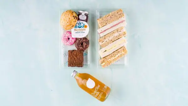 Children's afternoon tea box with delicious assortment of sandwiches and cakes