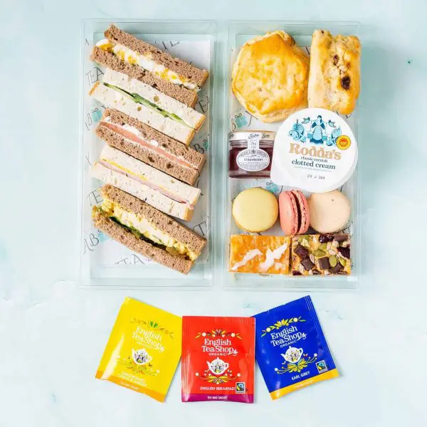 Gluten free vegetarian afternoon tea box with sandwiches, cakes and artisan tea