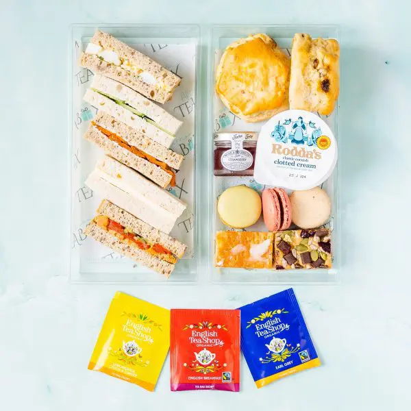 Gluten free vegetarian afternoon tea box with sandwiches, cakes and artisan tea